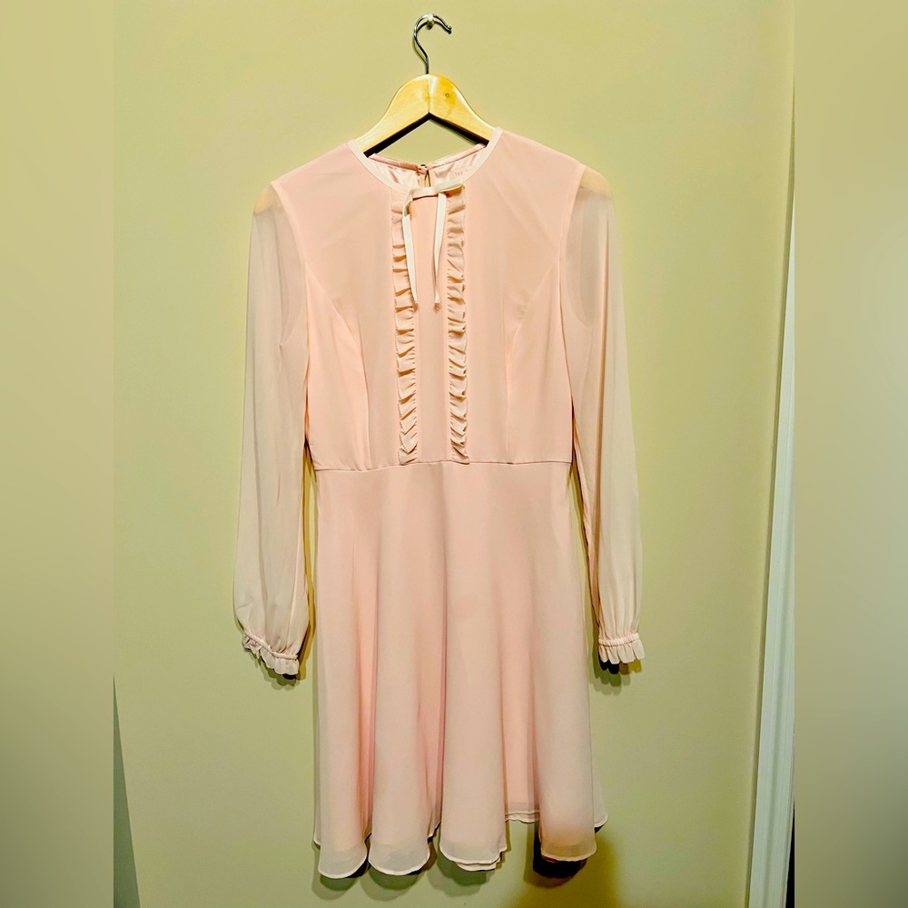 A lovely baby pink dress. Perfectly fitted yet comfortable